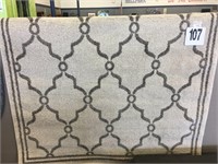 4 X 5 TAN PATTERNED AREA RUG