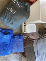 Tarps, extra bed, trashcan, small metal table,