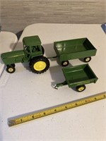 Small toy John Deere tractor, two trailers