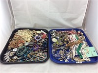 Two large trays of costume jewelry