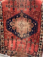 Hand woven wool rug, approx. 87" long by 57" wide