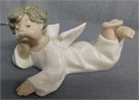 Lladro porcelain angel lying down, 5.5" long