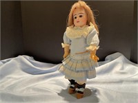 Doll made of wood composition