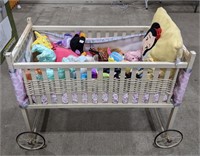 Baby bed with various stuffed dolls measuring 35