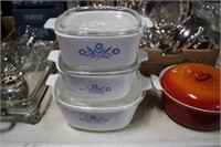 STACK OF CORNINGWARE WITH LIDS