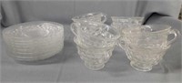 Eight Fostoria American glass cups and saucers
