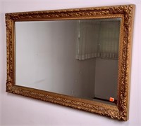 Gold mirror, faux wood frame, beveled glass,