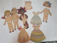 lot of vintage paper dolls with outfits