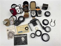 Assorted light meters, photographic accessories