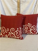2 RED "SOLARIAM" THROW PILLOWS - LIKE NEW