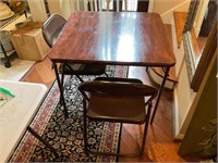 A Card Table with Two Chairs
