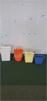 4 assorted plastic trash cans