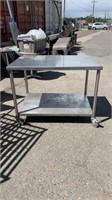 46” x 31 1/2” stainless steel table with wheels &