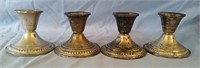 Lot of 4 sterling weighted candle holders