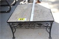 Patio table with stoneware top