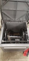Storage box with hose reel for
