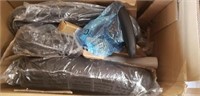 Black office task chair still disassembled in box