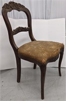 Antique carved side chair. 34" H.