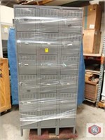 Locker by Uline. Seems New 18 compartment. Grey..