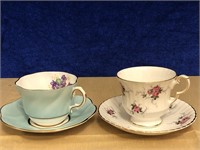 PAIR OF BONE CHINA TEACUP AND SAUCER SETS.