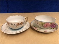 PAIR OF BONE CHINA TEACUP AND SAUCER SETS. HAND