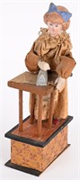 GERMAN BISQUE HEADED WOMAN IRONING SQUEEZE TOY