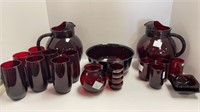 (2) red glsss pitchers w/ (7) tall glasses, (4)
