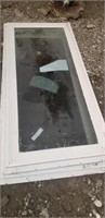 Used beige, pair of transom windows, 55x24"