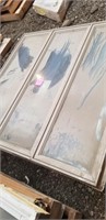 Sand colored 5x5 triple casement window,  dirty