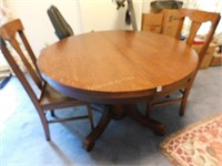 Oak pedestal dining table w/2 oak chairs, 45" dia
