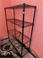 black metal shelving unit w/ 4 shelves