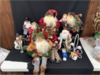 Large Assortment of Santa Clause Figurines and Hol