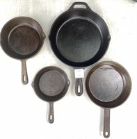 Four Vintage Seasoned Cast Iron Skillets