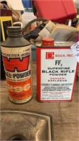 Empty black powder cans