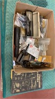 Box lot of firearm parts and book