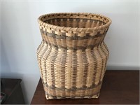 Large woven basket measures 18 inches tall,