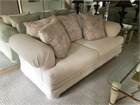 Large white sofa with ottoman