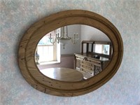 Oval wooden wall mirror