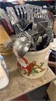 Christmas pottery full of kitchen utensils