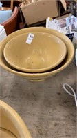 2 pottery bowls 12 inches wide and 10 inches wide
