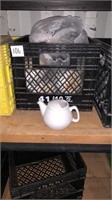 Milk crate of single serve tea pots