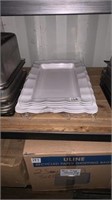 Five white serving trays