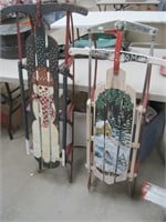 2 Christmas painted sleds 55" and 47" long