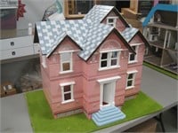 doll house on lawn board