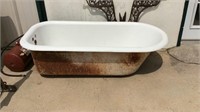 Porcelain claw footed bath tub