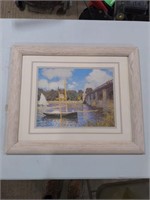 painting of boats and a bridge and wooden frame