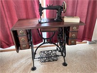 Antique sewing machine w/ cast iron base