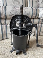 Antique cast iron fruit press