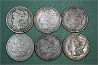 Six US Morgan O mint silver dollars:1882, 87, 89,
