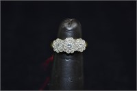 Lady's 18kt gold 3 flower motif ring set with 27 f